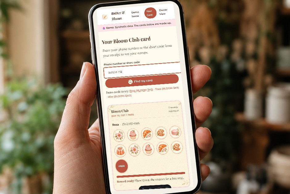 A phone held in a hand showing the Butter and Bloom loyalty card with collected stamps.
