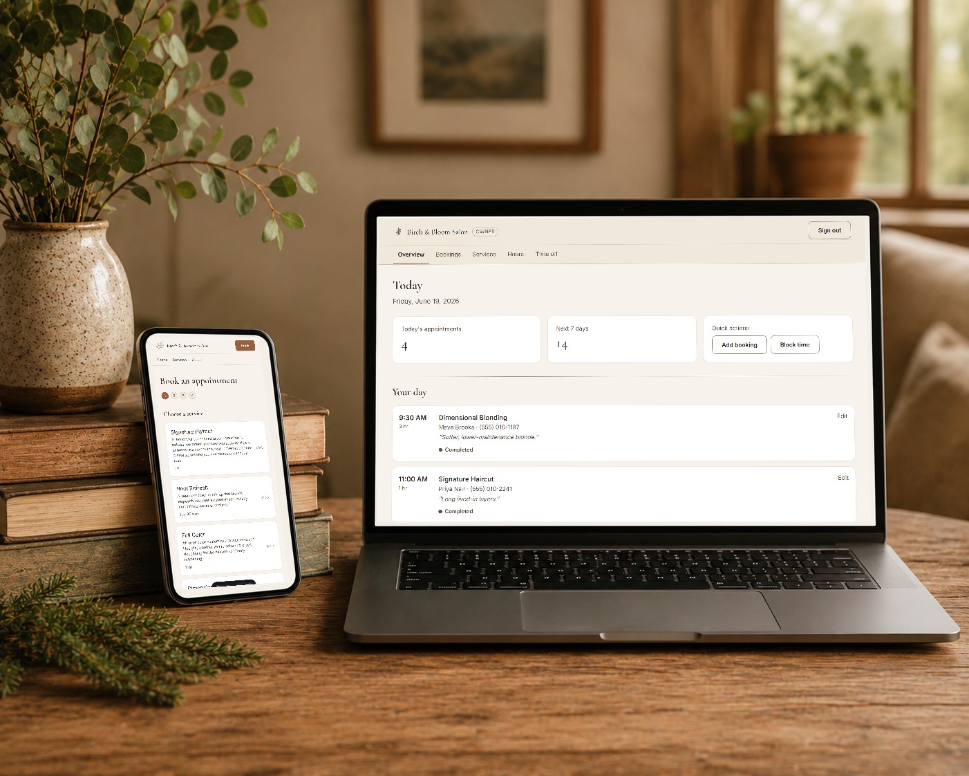 A phone and laptop together, the client side and the owner side of an online booking system.